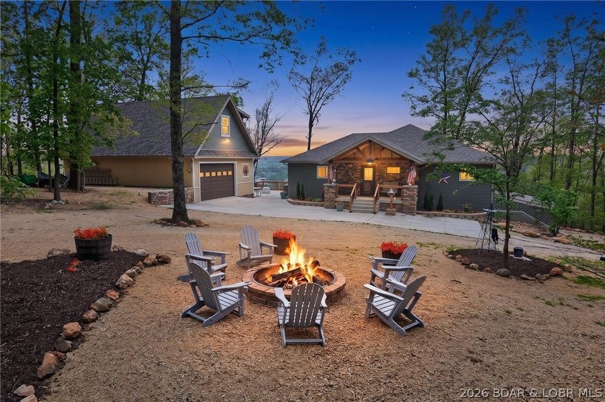 Exceptional newer custom-built ICF home on 3.5 acres with panoramic views of the Big Niangua, extending past the Hwy 54 bridge and Old Kinderhook. Built with Insulated Concrete Forms, this home offers superior construction, energy efficiency, and low utility costs. The main level features luxury vinyl plank flooring, 36” doorways, and an open layout. The custom kitchen includes alder cabinetry, granite countertops, high-end appliances, pantry, and a German silver hand-hammered sink. The living and dining area open to a covered upper deck to take in the views. The primary suite offers a large walk-in closet with custom stairs leading to a bonus room above. A striking Paragon spiral staircase leads to the lower level with a second kitchen featuring Brakur cabinetry, granite counters, stainless appliances, second living area, two guest bedrooms, and full bath. Outside offers expansive entertaining space with a full-length patio and additional lower patio. The 36x24 heated/cooled garage features epoxy floors, spray foam insulation, 2x6 walls, and a finished studio apartment above with full bath and kitchenette. Come see this custom home today! UNDER CONTRACT WITH 72HR KICKOUT