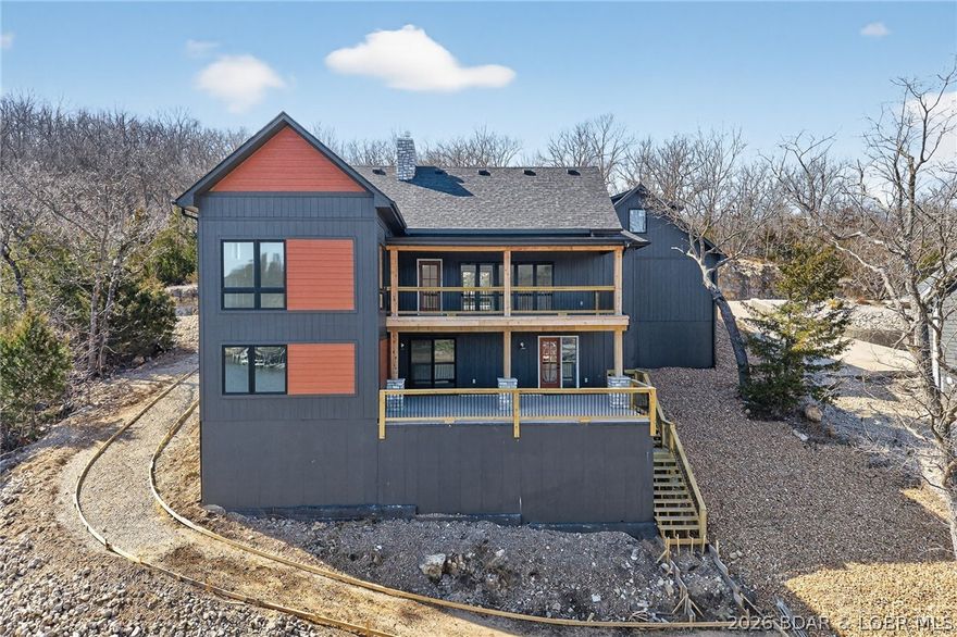 BRAND NEW!! This stunning home offers an abundance of space and comfort. You will love the effect the wooden beams create in the great room. This main level features large windows and custom full glass moving wall doors that afford killer views and open the house to accommodate inside /outside entertaining. Let the kids enjoy themselves in their own private bunkroom, keeping the lower level open for guests. The concrete cart path to the waterfront is currently being installed. The seller is allowing a $50,000.00 concession for purchase of dock. Don't miss out on this great home.  Cove location in an upscale subdivision.