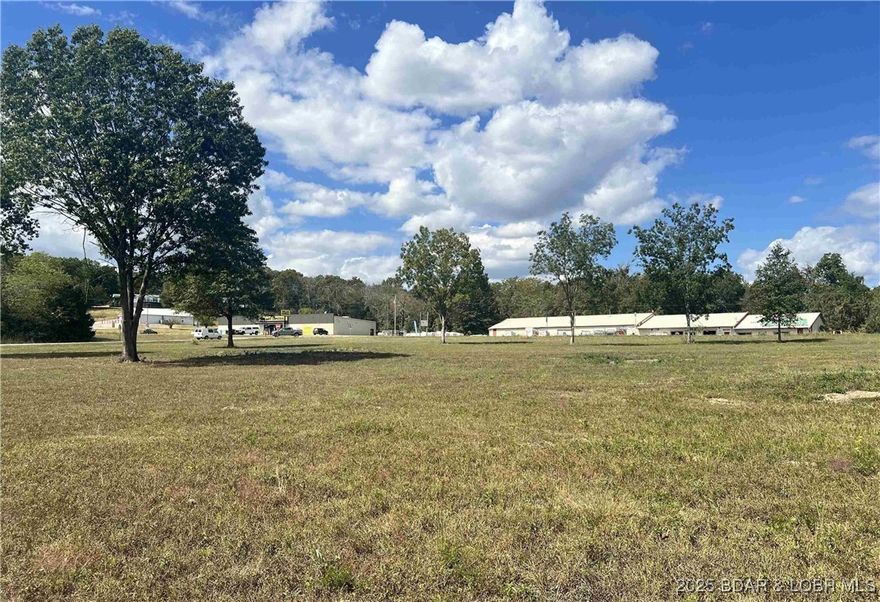 PRIME INVESTMENT OPPORTUNITY! These 14 acres offer an outstanding opportunity to build anything that you can imagine. This property is located within 5 minutes from Drake Harbor and downtown Warsaw, as well as multiple marinas and boat ramps on Truman Lake and Lake of the Ozarks. Surrounding businesses and location complement this prime location for your business to strive! Lots of blacktop frontage on 2 sides and bordering Corps. ground on the south side make this the perfect spot to build a bustling RV Park. This is a can't miss opportunity.