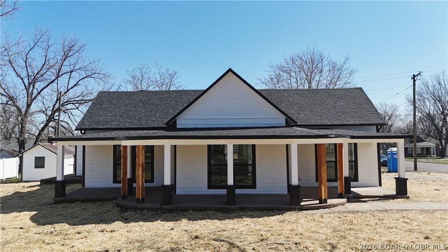 Charming 3 Bed, 2 Bath Home Ideal for Modern Living in Eldon, MO, just steps from schools, shopping, and medical facilities. This stunning house has been stripped down to the studs and fully remodeled, so you can enjoy the charm of a historic home with all the modern conveniences. It’s like finding buried treasure but without the pirates!Everything is new from the roof and HVAC to fresh paint and fixtures, making it ready to welcome you with open arms and maybe a confetti cannon. Picture yourself sipping your morning coffee on the wrap-around porch that little girls and whimsical adults dream of, perfect for relaxing or snapping a mugshot for your social media.Set on a large corner lot, this home gets plenty of attention and curb appeal your neighbors might need sunglasses to handle its radiance. With 2 master suites, it’s designed for comfort, making it ideal for families or that extra-long slumber party you’ve been planning.The stylish shiplap accents offer a trendy touch that looks straight out of HGTV. Don’t miss this chance to own a beautifully remodeled gem in an unbeatable location. Schedule your showing today and prepare to fall in love faster than a kid in a candy store!