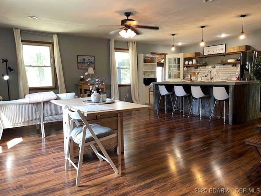 Welcome to your own private retreat! This ranch home offers 3 bedrooms and 2 baths, along with an updated farmhouse kitchen featuring concrete counters, subway tile backsplash, and open rustic shelving. Inside and out, there’s plenty of room to relax or entertain—enjoy the screened-in deck, fire pit, and open living spaces. The 30’ x 40’ shop is a standout—complete with concrete floors, a 12’ overhead door, and finished space that adds a 4th (and potential 5th) bedroom. Perfect for RV storage, projects, or a separate guest area. Set on 2.5 acres in the gated Forbes Lake of the Ozarks community, you’ll also have access to stocked fishing lakes, Lake of the Ozarks, tennis courts, campgrounds, RV park, and more. A great mix of comfort, space, and amenities—come take a look and see all this property has to offer.