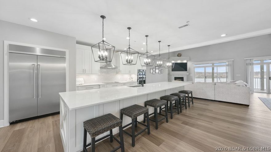 This doesn't come around often. Owner Financing Available. This one-of-a-kind Stoneledge Condominium is the only one with this exclusive floorplan that you do not want to miss out on. Featuring 4 spacious bedroom suites and 2 versatile loft areas, there's room for everyone to spread out and enjoy. Three suites are on the walk-in main level, while the upper-level suite boasts its own private living space—perfect for guests. And the best part? No steps to get inside! With elevator service from the parking level to the pool level, convenience is built right in. The full-length, tiled covered deck offers breathtaking main channel views—an ideal spot for dinners, drinks, and unforgettable sunsets. Love the lake life? You’ll fall for the stunning views right from your covered balcony and oversized 16x48 boat slip—plenty of room for your dream boat and then some. Quality is UNMATCHED at Stoneledge, known for its superior construction and peaceful, upscale environment with no short-term rentals (under 6 months) allowed. Location, views, space, and style—this is lakefront living at its finest!