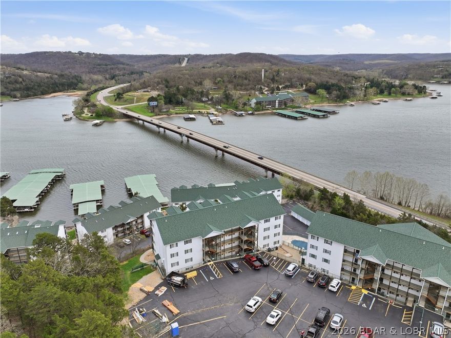 Top-floor condo with soaring vaulted ceilings and dramatic double-stacked windows, offering abundant natural light and scenic views from both the main level and loft. This 3-bedroom, 2-bath unit features an open-concept floor plan ideal for easy lake living and entertaining.

The updated kitchen boasts new cabinets, countertops, backsplash, stove, microwave, and wine cooler—blending modern style with everyday functionality.

Interior highlights include a cozy fireplace, laminate and tile flooring, ceiling fans, walk-in shower, cable availability, and automatic sprinkler system. Rental opportunities are permitted with HOA registration and fee, making this property a great option for personal use or investment.

Enjoy community amenities including a clubhouse, pool, and open deck spaces—perfect for relaxing and embracing the lake lifestyle.