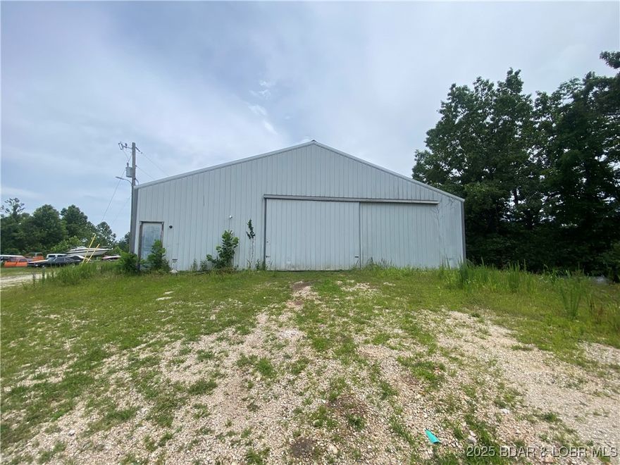 Back half of shop building for lease, shop is equipped with water, sewer, three phase electric and a spacious flat parking.