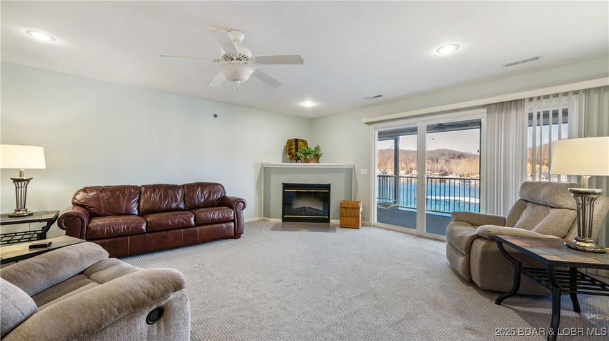 WALK-IN WITH NO STEPS! Drop your bags and start enjoying your own piece of paradise! This furnished two-bedroom two bath lakefront condo features an open floor plan designed for easy entertaining and relaxed days at the lake. Step out onto the spacious screened deck providing the perfect place to sit back and enjoy your coffee while watching the water shimmer with a view of your 12x30 boat slip just below. Tucked into a large, deep-water cove, the lake is your playground for skiing and floating just outside your door. Wind down the day at the lakefront pool, then enjoy the added convenience of nearby popular lakefront and land-based restaurants. No rentals are allowed, making this condo ideal for full-time living or a weekend escape. Come take a look!