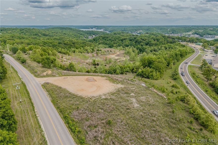 Discover a prime development opportunity in the heart of Greenview! This 46.24-acre property, zoned B-2 (General Commercial), offers limitless potential for a variety of projects. Located in an up-and-coming area of Camdenton, it features frontage on both Hwy 5 and Twin Rivers Pt. The elevated portion boasts breathtaking views, ideal for a bar, restaurant, lodging, apartments, a new subdivision, storage units, shopping center, etc. Let your imagination take the lead! The lower section is perfect for retail shops or could be rezoned for residential development. The property already has roads cut in and includes two small ponds, adding to its appeal. Opportunities like this are becoming increasingly rare in the area—don’t miss your chance to make your vision a reality!