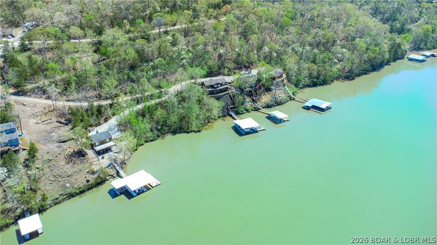 Build your dream lake escape on this stunning lakeview lot tucked away on the quiet side of Lake of the Ozarks. Offering breathtaking views—wide water, peaceful surroundings, and a level of tranquility that’s getting harder to find.

Whether you're envisioning a full-time residence or a weekend retreat, this property provides the perfect setting to create something truly special—where mornings start with coffee overlooking the water and evenings end with sunsets and stillness. There’s room to design a space that fits your lifestyle, surrounded by nature and privacy, yet still close to everything you love about the lake lifestyle.

By water, you’re near favorites like The Cave Restaurant, Nauti Fish Rum Bar, and Larry's on the Lake, along with the iconic Bridal Cave. By land, enjoy breakfast at Rise & Shine Cafe and explore the trails and castle ruins at Ha Ha Tonka State Park, then choose from the Hillbilly Hut or the Burger Basket on your way home.

This is the quieter side of the lake—where the pace slows, the views stretch wide, and the experience feels like the lake was meant to be.

POTENTIAL ADDED BONUS!!! An adjacent lot is also available to expand your footprint.