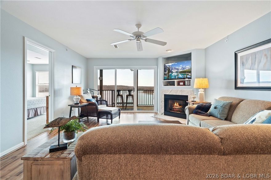 Slow down, breathe it in, and let the lake do the rest—this is where peace and panoramic views become part of your everyday life. Nestled alongside the natural beauty of the Lake of the Ozarks State Park, this beautifully furnished 2-bedroom, 2-bath condo offers a serene escape with calm waters and stunning scenery right outside your door.

Overlooking one of the most tranquil areas of the lake, this 1,050 sq ft retreat is perfect for relaxing mornings, sunset views, and effortless lake days. Enjoy the best of both worlds with a quiet setting while still being just minutes from Osage Beach dining, shopping, and entertainment.

Fully furnished and move-in ready, it’s ideal as a personal getaway or investment with nightly rentals allowed. Easy access with just one level up from parking makes coming and going simple.

A 12x32 boat slip with lift is included, giving you immediate access to some of the best boating and fishing on the lake. The complex also offers a pool and playground, making it perfect for family and guests.
Peaceful, inviting, and truly special—this is a place you’ll want to call home.
