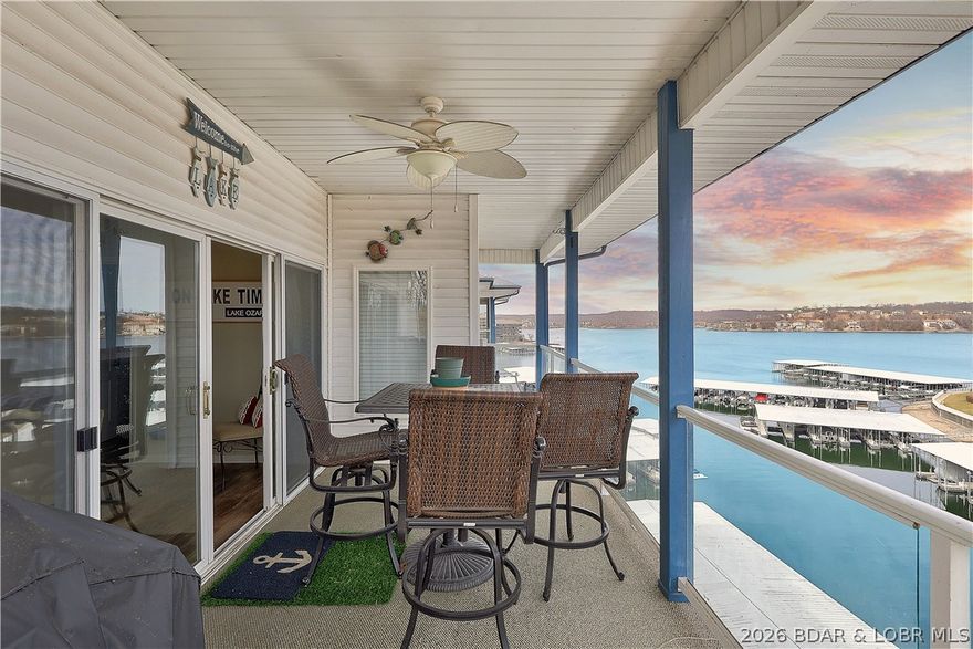 Welcome to Monarch Cove, where this fully furnished, top-floor end unit delivers comfort, views, and turnkey convenience. Offering three bedrooms and two bathrooms, the condo captures beautiful lake views and abundant natural light throughout. The open-concept living space flows into a modern kitchen, creating an ideal setting for entertaining or relaxing after a day on the water. Step out onto the private balcony to enjoy the lake atmosphere.

The primary suite features an updated en-suite bath with a refined feel. Two generously sized guest bedrooms are complemented by a recently updated full bathroom, making the layout both practical and inviting.

This unit includes a 12x36 boat slip with immediate access to the lake at the 2mm, along with two included personal watercraft. Owners enjoy access to three community pools, private parking, and elevator access.

Ideal as an investment property, vacation retreat, or full-time lake residence, this condo is conveniently located near shopping, dining, and popular lake attractions for easy entertaining.