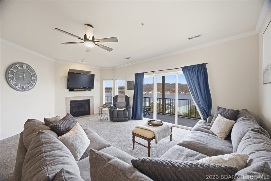 Experience true lakefront living at 440 Cedar Heights, Unit 1B, ideally located at the 13 Mile Marker of the Big Niangua at Lake of the Ozarks. This expansive fully furnished 4-bedroom, 4-bathroom condo offers approximately 2,993 square feet across two levels and lives more like a private lake home than a traditional condo. As a desirable wedge unit, it captures sweeping main channel views while offering added privacy. The open-concept main level features spacious living and dining areas, new carpeting, and seamless access to one of two oversized screened-in decks, creating exceptional indoor-outdoor living. The walk-out lower level includes a second full living area, bar space, and direct access to the dock. A 12x30 boat slip and two PWC slips with lifts are included, providing immediate water access just steps from your door. Cedar Heights allows nightly rentals and offers elevator access, all in a prime location close to boating, dining, and entertainment on the Big Niangua. Pre-listing inspected and a one year home warranty is included for added peace of mind.
