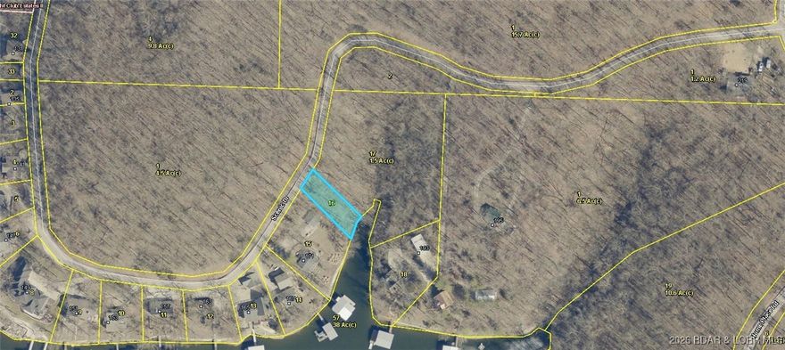 Check out this Lakefront lot at an unbeatable price! This rare opportunity offers a lakefront lot at the 3 Mile Marker in the highly desirable Yacht Club Estates Subdivision, providing a peaceful and tranquil setting for your custom lakefront home. Situated in a cove-protected location, the lot features calm waters and beautiful lake views, making it ideal for boating, relaxing, and enjoying the lake lifestyle. Located within the School of the Osage District and just minutes from historic Bagnell Dam, as well as the area’s best shopping, dining, and entertainment, this property offers both convenience and serenity. Wake up each day to the sights and sounds of the lake while enjoying the privacy only a cove location can provide! Where else can you get a Lakefront Lot at this price? Don't miss out on this amazing opportunity!