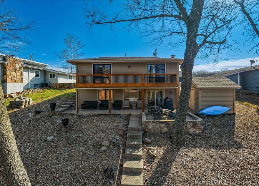 Beautifully remodeled and perfectly positioned at the 35 MM of the Osage, this 3 bedroom, 3 full bath with (1 extra small non-conforming bedroom ) lakefront home checks every box! Tucked away on a quiet, flat cul-de-sac, you’ll love the easy access with a flat driveway and extra parking for family and guests. Inside, the home has been completely updated with brand new flooring, paint throughout, fully renovated bathrooms, modern fixtures, and a brand new roof in 2025—offering a fresh, move-in ready feel throughout. Step outside to enjoy calm, deep cove water at your private dock, perfect for swimming, boating, and year-round use. The shoreline has already been improved with new rip rap, and the dock electrical is up to code for peace of mind. Whether you're relaxing on the water or entertaining, this setup is ready to go. Located just minutes from some of the lake’s most popular waterfront destinations like Captain Ron’s, The Cave, Fish & Company, and more, you’ll have the perfect blend of quiet cove living with easy access to all the action. Being sold fully furnished and complete with a boat lift, this turnkey property is ready for you to start enjoying lake life immediately!