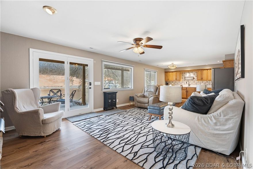 Beautifully remodeled and perfectly positioned at the 35 MM of the Osage, this 3 bedroom, 3 full bath with (1 extra small non-conforming bedroom ) lakefront home checks every box! Tucked away on a quiet, flat cul-de-sac, you’ll love the easy access with a flat driveway and extra parking for family and guests. Inside, the home has been completely updated with brand new flooring, paint throughout, fully renovated bathrooms, modern fixtures, and a brand new roof in 2025—offering a fresh, move-in ready feel throughout. Step outside to enjoy calm, deep cove water at your private dock, perfect for swimming, boating, and year-round use. The shoreline has already been improved with new rip rap, and the dock electrical is up to code for peace of mind. Whether you're relaxing on the water or entertaining, this setup is ready to go. Located just minutes from some of the lake’s most popular waterfront destinations like Captain Ron’s, The Cave, Fish & Company, and more, you’ll have the perfect blend of quiet cove living with easy access to all the action. Being sold fully furnished and complete with a boat lift, this turnkey property is ready for you to start enjoying lake life immediately!