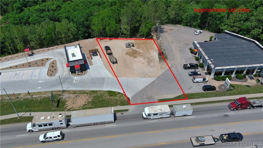 Prime commercial opportunity in a high-visibility location next to Scooter’s Coffee with direct frontage on Highway 54! This prominently positioned site offers unmatched exposure, with over 24,000 cars passing daily according to the 2023 MoDOT map. Conveniently located near the lake, fishing, golf courses, schools, bars, and restaurants, this property is perfectly placed for a variety of business ventures. City Water and Sewer connections are easily accessible, and the C-2 zoning offers flexible commercial possibilities. Whether you're launching a retail space, service business, or professional office, this lot delivers location, traffic, and convenience. Some restrictions apply to adjoining businesses, ensuring a strong surrounding mix. With growing development in the area and Osage Beach's continued expansion, this is a smart investment with huge potential. Ready for your next venture? Don’t miss your chance to secure a premier spot in one of the Lake’s fastest-growing corridors—inquire today!