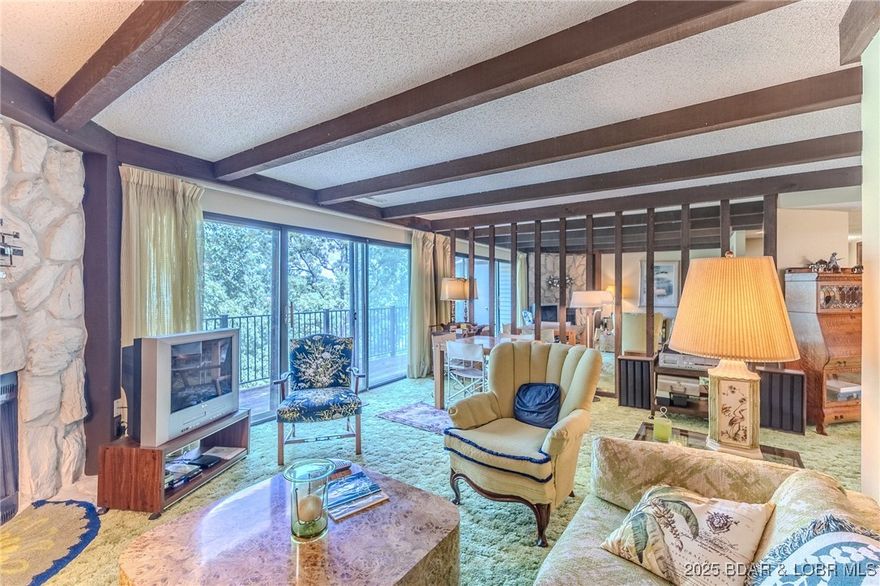 Spacious 3 bedroom condo offering generous living space & is perfectly situated within one of the area's most sought after complexes. The expansive primary suite features his & hers closets & an large open area ideal for a walk-in closet, storage, or a custom dressing room. The open concept main living area features an electric fireplace that adds warmth & charm during cool fall days. All 3 bedrooms offer direct access to a spacious deck, perfect for relaxing. Located in a prime spot within the complex, you're just a short walk from the pool, clubhouse, and playground. Prefer to cruise instead? Golf carts are welcome throughout the complex. Complex amenities include on-site management, security, a fire pit area, swimming pool, clubhouse, playground, boat ramps, tennis/pickleball courts, a waterfront walking/golf cart path, exercise area, waterfront viewing platform, & lush, manicured landscaping. Boat slips are available through the association up to 14x32