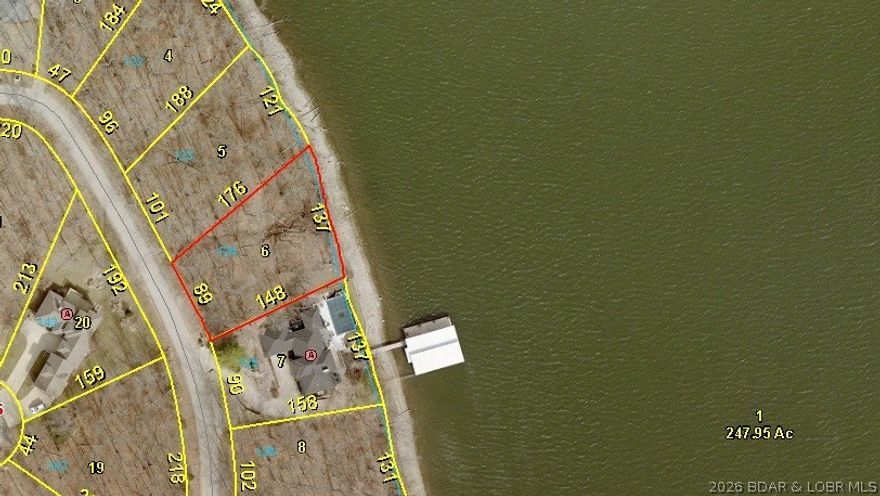 ONE OF THE "BETTER" VIEWS OF THE LAKE…....GREAT LOT....…COVETED COVE PROTECTION……DEEPER WATER……EASTERN EXPOSURE…… “PRIVACY OF A DEAD-END STREET”.....(137 LIN. Ft. of BEAUTIFUL LAKEFRONT)...Lot Dimensions are (137 L.F. x 149 x 90 x 176)... Premier location in Porto Cima where the Jack Nicklaus designed Golf Course, The Porto Cima Yacht Club & The Club at Porto Cima are right around the corner with a variety of memberships available. Includes use of all Four Season's amenities including; Hiking & Biking Trails, RV Park and Camping, 3 Private Fishing Lakes, Multiple Pools, Tennis Court, Kay's Point Pavilion and Playground, Kay's Point Dock & Boat Launch, Skate Park & Basketball Courts.