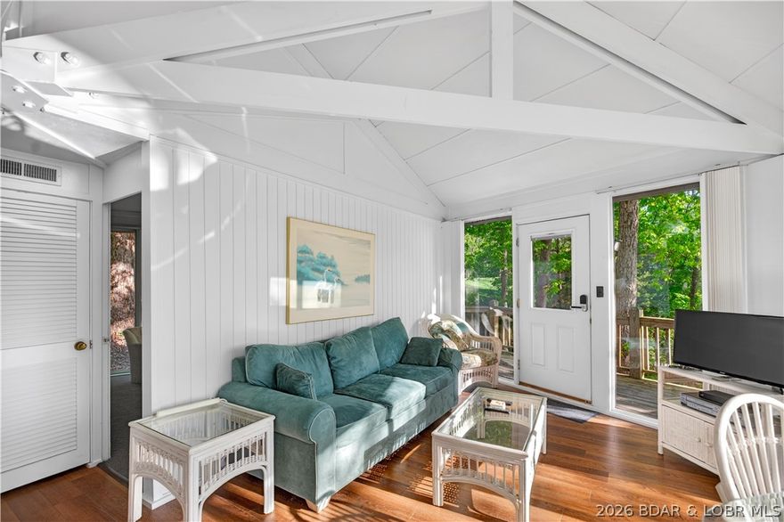Enjoy treehouse-style living with all the perks of lake life! This unique 2-bedroom, 2-bath stand-alone villa in Tree Top Village offers two spacious levels, each with its own private suite plus an extra full bath. Nestled among the trees, the home features an open-concept layout, vaulted ceilings, and a private deck with seasonal lake views. Residents enjoy resort-style amenities including indoor/outdoor pools, pickleball courts, lake access with boat slips, and full Four Seasons privileges. Perfect for a weekend getaway, vacation rental, or year-round living.