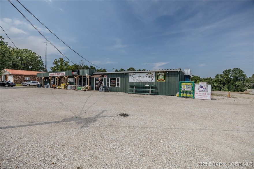 ¼ Mile to Camdenton & 1 Min. to New Hwy 5 Exit Ramp. GREAT LOCATION.  Well maintained approx. 11,491 SqFt Metal Building all under one roof on 2.6 Acres w/ 200 ft of Hwy Frontage. Just Outside the City Limits, Across the Rd from Catholic Church. This Includes PROPERTY/BUILDING ONLY. The Building is well maintained & is in good condition & consists of Approx 3,491 Sq Ft of Show Room Retail/Office Spaces, approx. 1,900 Sq Ft Large Storage Areas, 8,000 Sq Ft Warehouse w/ 2, 14 x 12 GARAGE DOORS. Expansive & Spacious Landfill Area (Which more than ½ has been filled) offering an abundance of additional park’g for vehicles, large equipment & room for expansion of the Build’g or to add structures. This property is surrounded by Numerous Successful Neighbor’g Businesses. Individual Showrooms for Equip. Dealership, Livestock Feed & Pet Supplies, Yard/Garden Décor & Supplies, Live Bait & Tackle, Liquor Sales. Must See EXTRA FEATURE SHEET in attachments for numerous DETAILS. This purchase price DOES NOT include the Business, Equipment, Inventory, Supplies, etc.