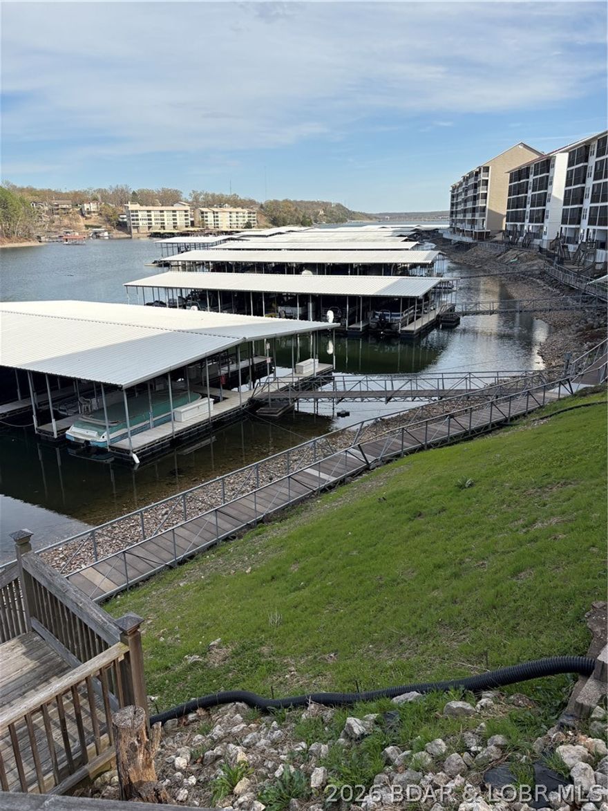 Enjoy all the perks of lakefront living, including easy water access, nearby dining and entertainment, and low-maintenance living so you can spend more time enjoying the lifestyle you deserve! This beautiful 2-bedroom 2-bath WALK-IN condo is perfect for that getaway! This beautifully maintained unit offers a perfect blend of comfort, convenience and lake life living. Step inside to a spacious living area or enjoy your private deck overlooking the channel. Whether you are looking for a full-time residence, weekend getaway with family and friends, or investment opportunity-this condo checks all the boxes! By land or water you are situated in a prime location for all the fun, great food and beautiful scenery the Lake of the Ozarks has to offer!