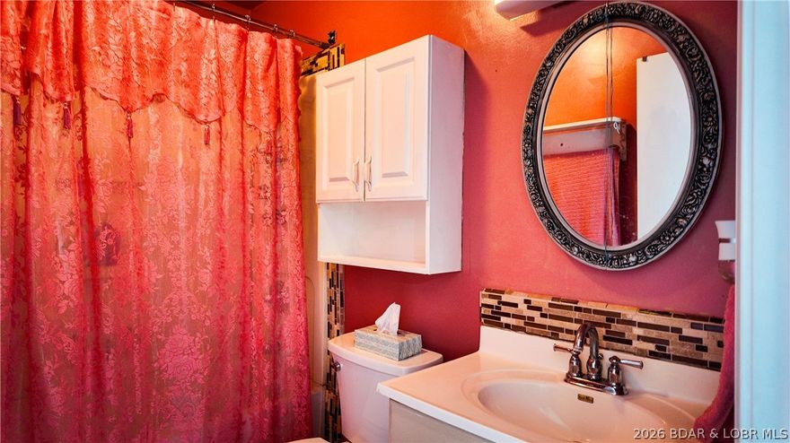 Charming, move-in ready home in Sunrise Beach with newer HVAC, vinyl flooring and more! Situated in a peaceful, park-like setting with 280 ft of road frontage and a newly finished blacktop driveway with parking for up to 6 vehicles. Enjoy the peace and quiet as you glance at the lake from your private deck, plus quick neighborhood access to the 10 MM lakefront. Survey completed and seller is motivated—bring your offer!