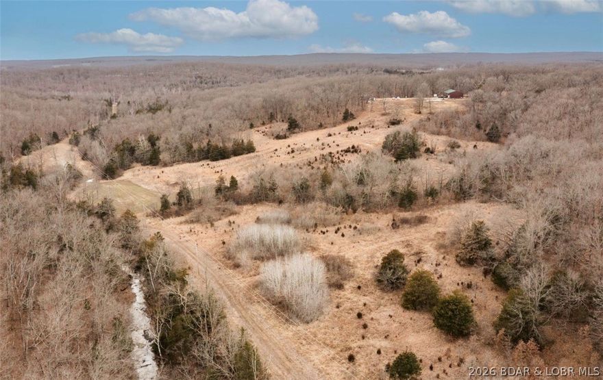 Rare opportunity to own 138.91 acres of prime recreational and hunting ground in the heart of Morgan County, just outside of Versailles, Missouri. This versatile property offers the perfect combination of privacy, functionality, and future potential.

The property includes a 40x30 (2 bedroom, 1 bathroom) home—ideal as a full-time residence, hunting cabin, or weekend retreat. A 64x40 three-bay shop with concrete floors provides ample space for equipment storage, vehicles, ATVs, boats, or workshop needs.

This acreage is a true outdoorsman’s paradise, featuring abundant wildlife including deer and turkey, making it an exceptional hunting property. The mix of open ground and timber creates excellent habitat and year-round recreational opportunities.

In addition to the existing home, the property offers a prime building site perfectly positioned for someone looking to construct their dream home overlooking nearly 139 acres of breathtaking countryside.

Whether you’re searching for a private retreat, income-producing recreational ground, hunting property, or a future homesite with acreage, this one checks all the boxes.