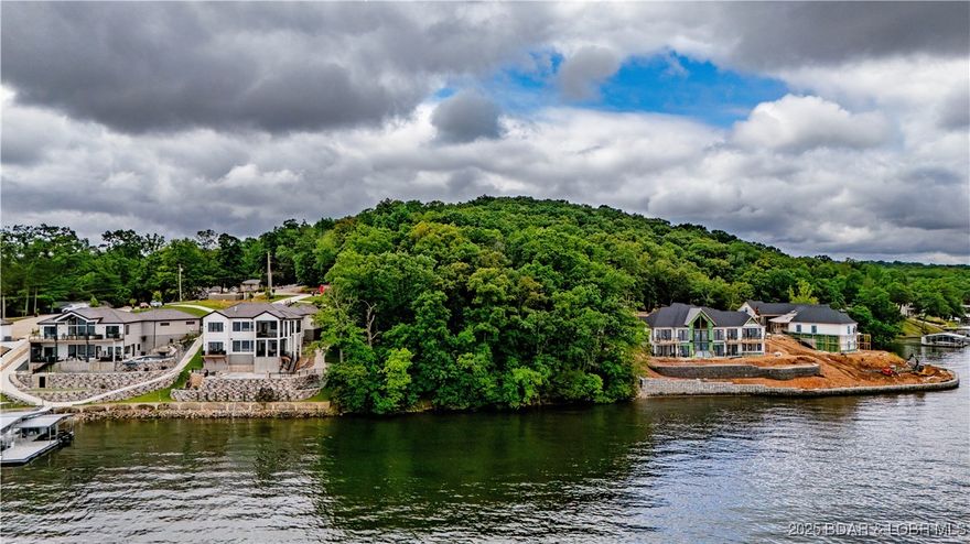 Build your dream lake home on this stunning lakefront lot featuring gentle topography and unobstructed panoramic main channel views at the 4MM. Located in a highly desirable area, right outside of Four Seasons, this property offers easy access to the water and endless possibilities for lakeside living. With a gentle slope ideal for a walkout build and views that stretch for miles, this is a rare opportunity to own a premium piece of Lake of the Ozarks shoreline.