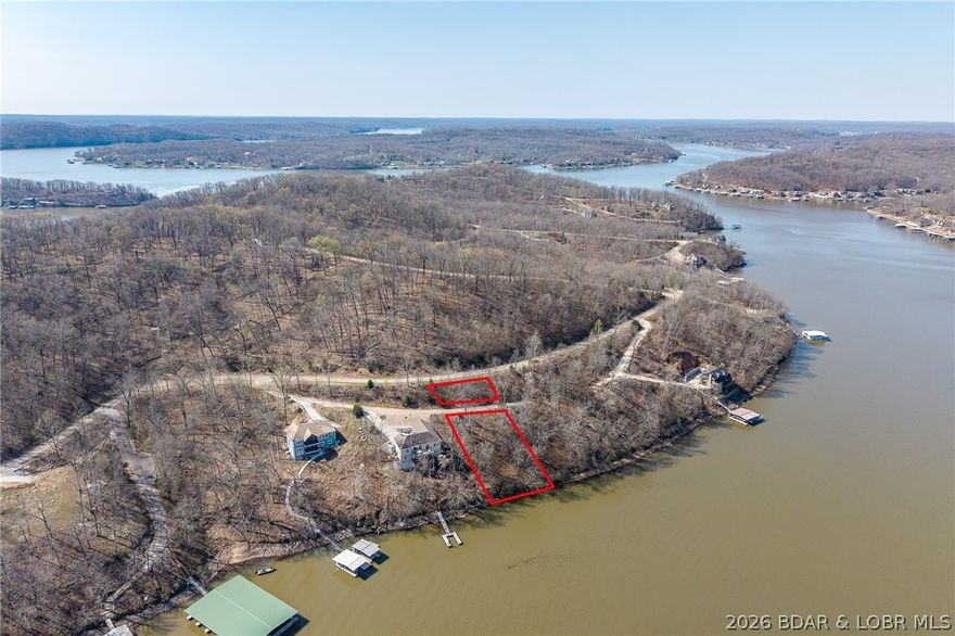 Lake Front lot ready for your dream home build! Located at the 55 Mile Marker of the Osage at Lake of the Ozarks this BEAUTIFUL area will WOW you! Community Water and Central Septic and paved roads all the way! DEEP water and a moderate slope to the land! Ready for you to make your own.