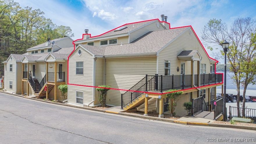 Experience the best of lakeside living in this unique property offering lots of living space w/cool nooks & crannies for privacy &/or to explore! Enjoy soaring vaulted ceilings,2 private open decks, & covered, screened porch w/unobstructed lake views. The extended living area w/bar is perfect for entertaining & the large dining table offers enough seating to feed a crew before you head out boating for the day. Breakwater Bay boasts top-notch amenities, including:large lakeside pool, martini deck, clubhouse, tennis & basketball courts. Close to Red Head, Shorty Pants, Margaritaville, & other popular spots. This package offers a turn key unit sleeping 12+, a covered assigned carport space right out your front door, BRAND NEW DOCK with a  12x32 slip w/Captains Choice hoist, & PWC slip w/lift. There have been many HOA investments over the past year 2 years including replacement of retaining walls, redoing lower parking lot, waterfront reinforcement project for erosion & landscaping, staircases being replaced with Trex decking & much more. Reserve Assessment for the Trex decking on staircases of $1424.50 per quarter, until 2027. Seller will pay Reserve Assessment to 12/31/27 for buyer.