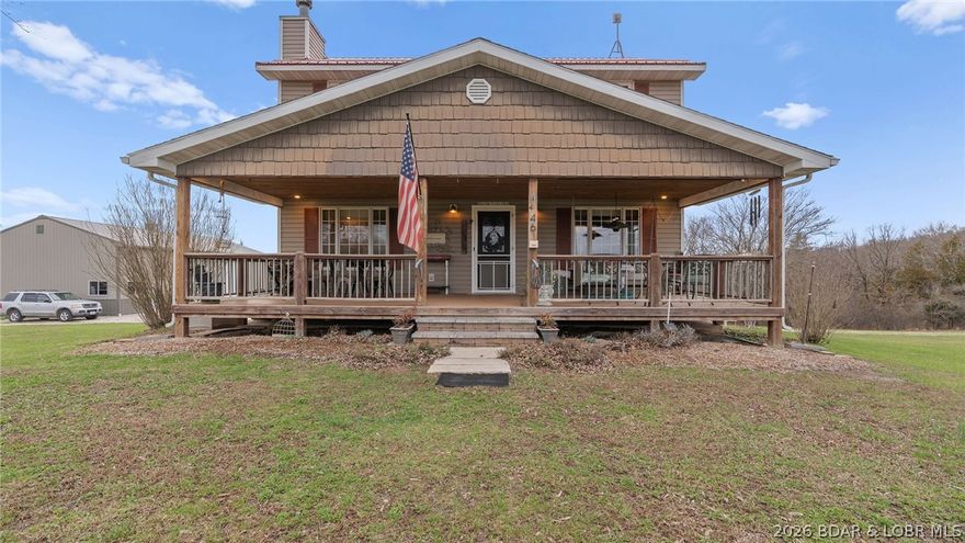 Escape to the quiet beauty of this classic Colonial style farmhouse set on 4 partially wooded acres. Blending timeless architecture with modern comforts, this 3 bedroom, 3 bath home offers spacious living, ample storage space, a full walk-out basement, & beautiful views in every direction. Enjoy relaxed mornings with a book and coffee on the covered front porch swing and peaceful evenings on the covered or open back deck, both perfect for taking in the scenic countryside. The property features an expansive detached 32 x 56 shop with two 12 x 12 garage doors, a large storage loft accessible by lift, 200 amp electric & water built in 2020. Also on the property is an additional 12 x 20 workshop with 100 amp electric, an attached 6 x 12 greenhouse and raised beds for year round gardening. A full RV hook-up with 30/50 amp electric and a dedicated drive grace the property. Conveniently located within easy reach of Jefferson City or the Lake of the Ozarks, this property blends country charm with modern convenience, great for gardening, hobby farming, or simply stretching out and savoring the privacy of the rural life. You have to see this home in person to appreciate its charm & beauty.