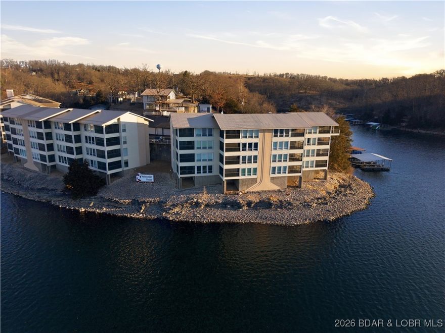 Enjoy a million dollar lake view for under $300K! This condo features a brand-new stove and microwave and offers the rare opportunity to watch the Lake Race right from your couch. Located in a small, quiet complex that’s close to everything, the community offers excellent amenities including a swimming pool, clubhouse with workout facility, and a fish cleaning station.
The spacious lakeside primary bedroom includes a large closet and walks out to a screened in deck with breathtaking lake views.
Included with a 10x28 boat slip, boat lift, and a drive on jet ski lift, making it ideal for lake lovers. A fantastic blend of peaceful living, convenience, and unbeatable views. Rental Info: 2024: $8K; 2025: $12K