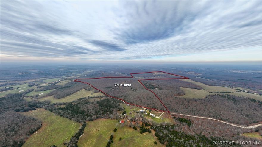 Calling all outdoor enthusiasts, hunters, cattle ranchers & dream-home visionaries! This remarkable 275± acre property offers some of the most captivating scenery in the region. Featuring nine fresh water ponds, a running water creek, mature harvest-ready timber & quality trails throughout, this land is a true natural haven. The property is gated, fully fenced & cross-fenced, making it ideal for livestock, recreational use or development of a private estate. A well is already in place & access to electric & phone is available. For hunters, this is truly prime ground with some of the largest deer in the Ozarks. The acreage offers exceptional Deer & Turkey habitat, complete with strategically placed deer stand & feeders. Wildlife thrives here, supported by abundant water sources & varied terrain. Whether you’re seeking unmatched hunting land, a working farm or the perfect location to build your dream home with panoramic Ozark views, this property delivers. Best of all, it’s located less than 30 minutes from Osage Beach, offering both seclusion & convenience. Properties of this size, quality & natural beauty rarely come to market—don’t miss this opportunity.