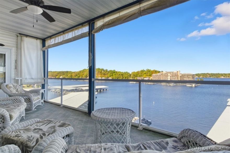 This light-filled condo with three bedrooms and three bathrooms offers a stunning view of the main channel water, situated near the elevator on the 5th floor. The living, dining, and kitchen areas are open, making them perfect for entertaining. A gas fireplace is perfect for chilly days. Solid surface countertops, stainless steel appliances, and upgraded kitchen cabinets. The master boasts a jetted tub, walk-in- shower, walk-in closet, and dual vanities. The second bedroom has a complete private bathroom. Admire the views from both sides of the screened deck. This Turn-key condo offers a 12x36 boat slip in front of the condo and an elevator from the unit to the lakefront pool. This sought-after complex features a half-mile coastal promenade, two hot tubs, and three heated pools. Located close to many of the waterfront hot spots, Bagnell Dam Strip, grocery stores, golfing, theater, and shopping