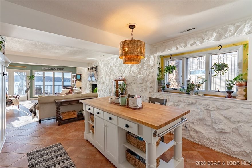 Front-row main channel views, an end-unit layout, and a boat slip plus PWC slip make this St. Moritz condo impossible to ignore. This 3-bedroom, 2-bath lakefront unit offers 1,430 square feet and the added benefit of only one neighboring unit to the left. Large windows and the end-unit position allow incredible natural light to flood the space, giving the condo a bright, airy feel throughout the day. The expansive deck delivers ridiculous main channel views and nonstop lake activity, creating the perfect backdrop for relaxing or entertaining. Inside, the condo features fresh paint, updated appliances, and an adorable refreshed bathroom. The painted Ozark stone adds subtle character while keeping the space bright and cohesive. Community amenities include a pool with beautiful lake views, a main channel swim platform, community dock, protected swimming area, and a community boat ramp. Annual rentals only, no nightly rentals allowed. This is a polished yet playful lake retreat with a layout that works, natural light that elevates the space, and views that steal the show.