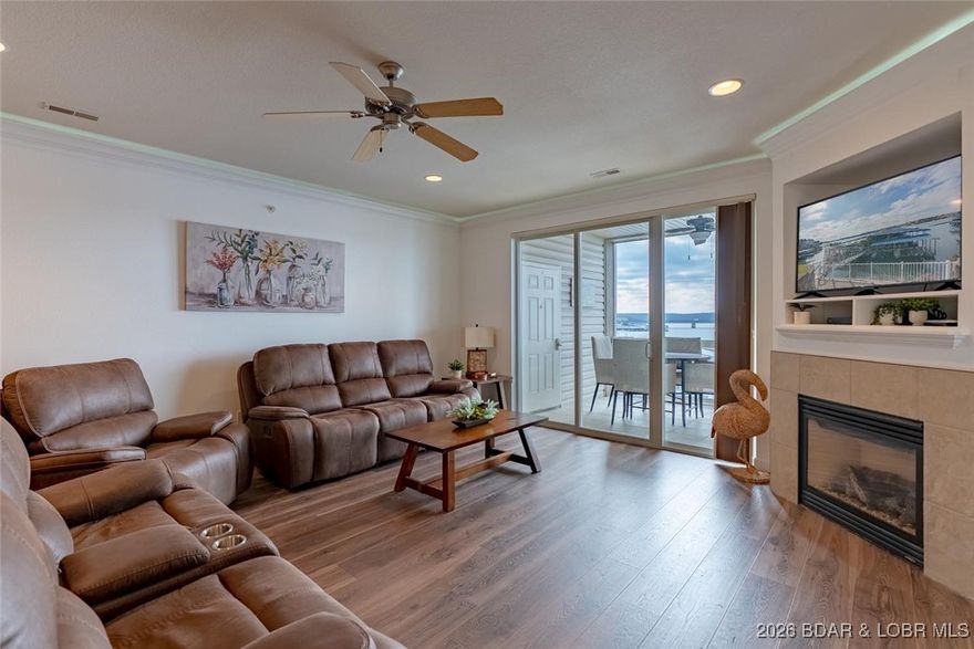 Lakeview Turnkey Investment Opportunity!This stunning 3-bedroom, 2-bath condo offers walk-in access with no steps & breathtaking lake views from every room. Designed for comfort & income potential, featuring a cozy fireplace, ambient lighting, & a luxurious primary bath with jacuzzi tub. The open layout flows easily to a screened deck—perfect for relaxing or entertaining—complete with a convenient deck closet. The kitchen is outfitted with brand-new appliances (2025), & a lockable owner/cleaning closet makes this an ideal rental or investment property. Boaters will appreciate the 14x40 boat slip offering prime access to the water. Conveniently located near top restaurants, shopping, trampoline park, & the popular Amusement Oasis, this unit offers easy access by land & water, making it attractive to renters & lake lovers. Located at Lands End, this complex is known for its amenities including a cove-side pool, lazy river, clubhouse, playground, fitness room, & protective wave breaks for calmer waters. Whether you’re looking for a personal lake retreat or a high-demand rental, this condo checks every box. Turnkey, income-producing, & ready to enjoy