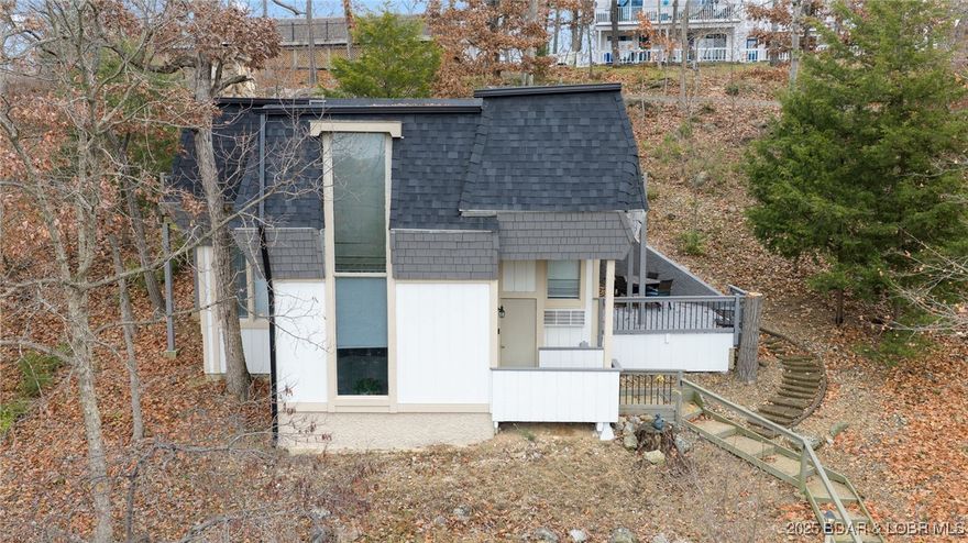 Great Investment property! This turn-key 3 bedroom, 3 bathroom rental is situated in Osage Beach in the heart of beautiful Lake of the Ozarks. Three fully furnished unit rentals in one! The walk in unit offers a full kitchen, fireplace, a master bedroom ensuite with a king bed, walk-in shower and closet, and laundry room. The upper level offers 2 separate units each with 2 King beds, a full bath, kitchenette, private heat & a/c, and a balcony. Live in the bottom unit and rent the top 2 units or, maximize your income potential and rent all 3! New updates include 4 PTAC units, exterior & interior paint, new appliances, new water heater, granite countertops, light fixtures, bathrooms, and new roof in 2023. This property has lake access and is just minutes from Margaritaville, Landshark, and other great restaurants and lakeside bar & grills. Rental earnings for 2023, 24, & 25 confirms this is a great investment! Take a look today!