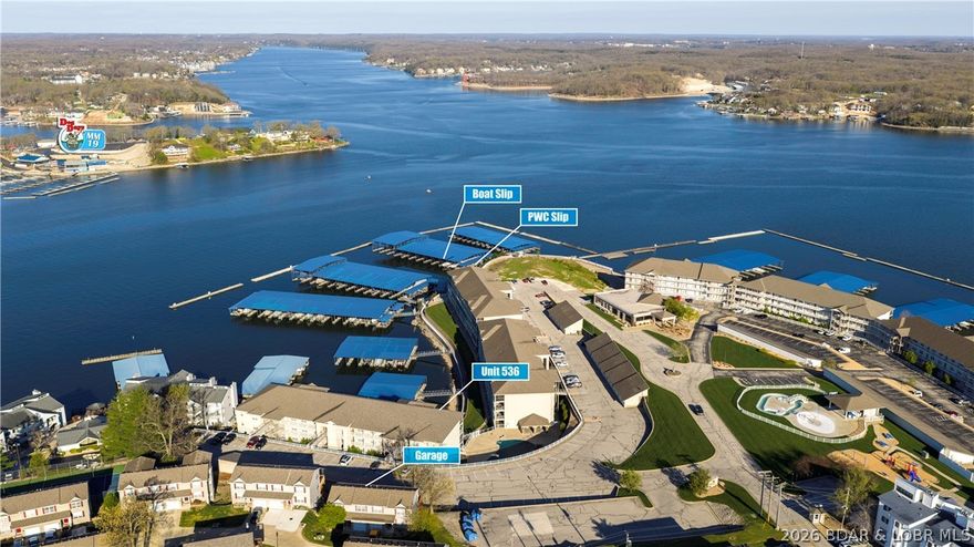 Lake lovers, this is your moment.  
Situated in one of the lake’s most sought-after complexes, this beautifully remodeled condo puts you in the heart of Osage Beach at the 19MM — where convenience, lifestyle, and luxury all come together. Spend your days floating the lazy river, relaxing by the traditional pool, getting in a workout at the fitness center, or heading straight out on the water from your own 16x48 ft slip, jet ski slip, and the rarest amenity of all; a hard-to-find garage. This unit truly checks every box. Inside, the upgrades shine: luxury vinyl flooring, stainless steel appliances, new water heater, fireplace, owner’s closet/pantry, upper lighting and new fans. Every detail has been thoughtfully refreshed. Picture yourself watching vibrant sunsets through your tinted windows or unwinding on your covered deck as the lake settles into evening. And for added peace of mind, this condo comes with a transferable home warranty. Opportunities like this are rare. Call today to schedule your private showing and claim your place at the lake.