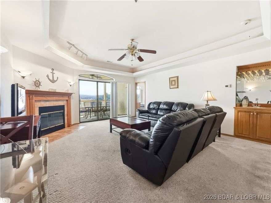 Aqua Fin Condo 3 Bedroom, 3 Bath that comes Furnished.  Living Room has a Gas Fireplace and Wet-Bar for entertaining with Sliders to a nice covered Deck with a Storage Closet.  The Kitchen has a built-In China Cabinet, Breakfast Bar & Tile Floors.  Master Bedroom/ Bath has a Jetted Tub, double Sinks Walk-In Shower & Sliders to the nice covered Deck.  The other 2 Bedroom Suites also have their own separate Bathrooms.  14x34 Dock Slip/Lift is included.  Quiet cove location with great Main Channel View.