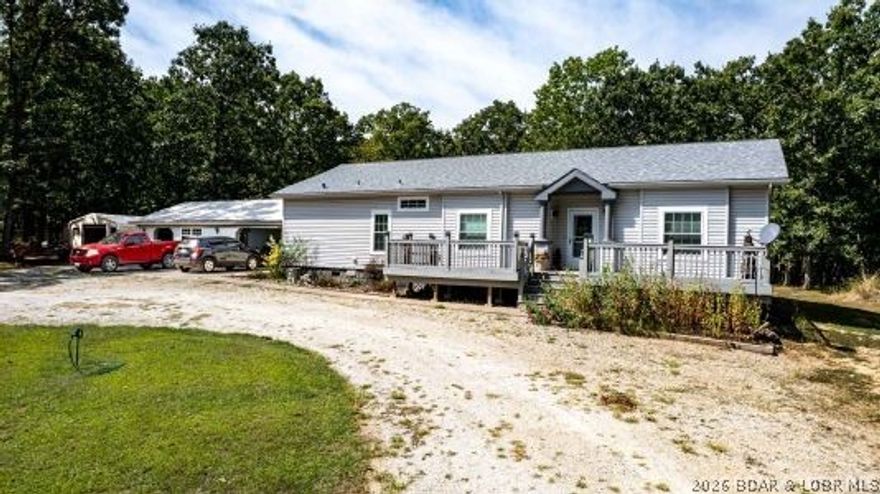 This stunning 3-bedroom, 2-bath, one level living, residence is nestled on a meticulously maintained 10.47-acre lot with 400 feet of highway frontage on Highway 135. The luxurious master suite features a jetted tub in the ensuite bathroom, and a spacious walk-in closet. The home itself boasts high-quality finishes, including bullnose drywall, custom solid oak cabinetry, and granite countertops. Outside, the property is an entertainer's dream. A beautiful atrium door leads to a deck built with Trex decking, perfect for enjoying the serene views of your mature oak trees. The front and back yards are tastefully landscaped with beautiful flower beds and a dedicated garden area. For the hobbyist or business owner, this property is an exceptional opportunity. It features an attached 2-car garage and an additional 23' x 23' workshop powered by a separate 200-amp service from the home. A storage shed and chicken coop are also on site. With its prime location near The LOOP Off-Road Park and The Ozark International Raceway, this property offers both a peaceful country lifestyle and potential for commercial ventures. Plus, it's just a short 20-minute drive to Laurie or Versailles, Missouri.