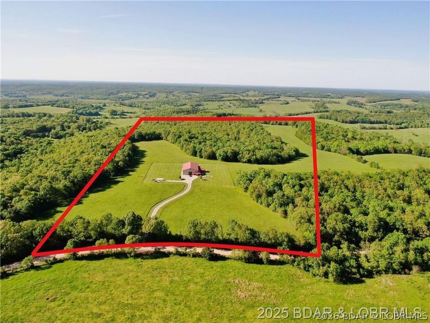 Stunning 80-acre Dream Farm perfect for farming, recreation, and ATV adventures — and just 30 minutes from the Lake of the Ozarks resort area. Built in 2017, the custom 1,788 sq ft Shouse features granite finishes, geothermal heated floors, fireplaces in both ensuite bedrooms, and a jaw-dropping 1,000 sq ft glass-enclosed Three Seasons Room. The 5,000 sq ft heated/insulated shop includes 14’x14’ doors for RVs and equipment, plus a full RV pad with hookups. Enjoy two spring-fed ponds, abundant wildlife, and wide-open spaces. This rare find blends upscale rural living with serious income or lifestyle potential. Looking for a business opportunity? This property is ideal for offering guided hunting and fishing experiences — or simply enjoying it as your own private paradise