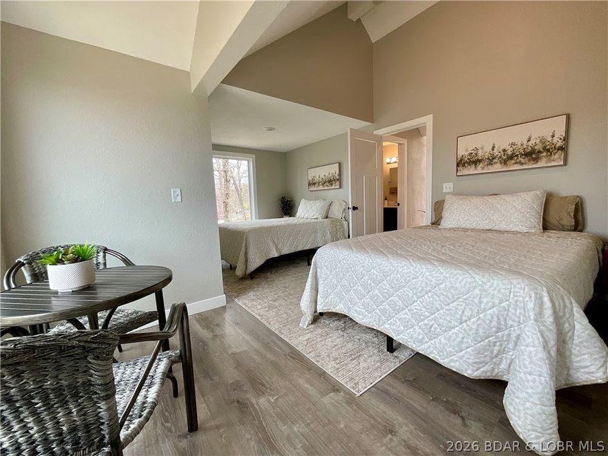 Welcome to lake living at its finest in the highly sought-after Tan-Tar-A Estates, neighboring Margaritaville Resort! This beautifully maintained home offers the perfect blend of comfort, space, and lifestyle—ideal as a full-time residence, vacation getaway, or investment opportunity. Step inside to discover an open and inviting floor plan with vaulted ceilings and abundant natural light.   The home is thoughtfully laid out for both relaxation and functionality. Enjoy stunning lake views from expansive decks, perfect for morning coffee or evening gatherings. Located in a golf cart-friendly community, you’ll love the easy access to an incredible list of amenities including pools, playgrounds, and FREE golf. Just minutes away, Margaritaville offers restaurants, bars, a swim-up pool, spa, arcade, bowling, and endless entertainment. Centrally located by both land and water, you’re close to everything Lake of the Ozarks has to offer—dining, shopping, and attractions. Whether you’re looking for a turnkey lake retreat or a high-demand rental property, this home checks all the boxes.