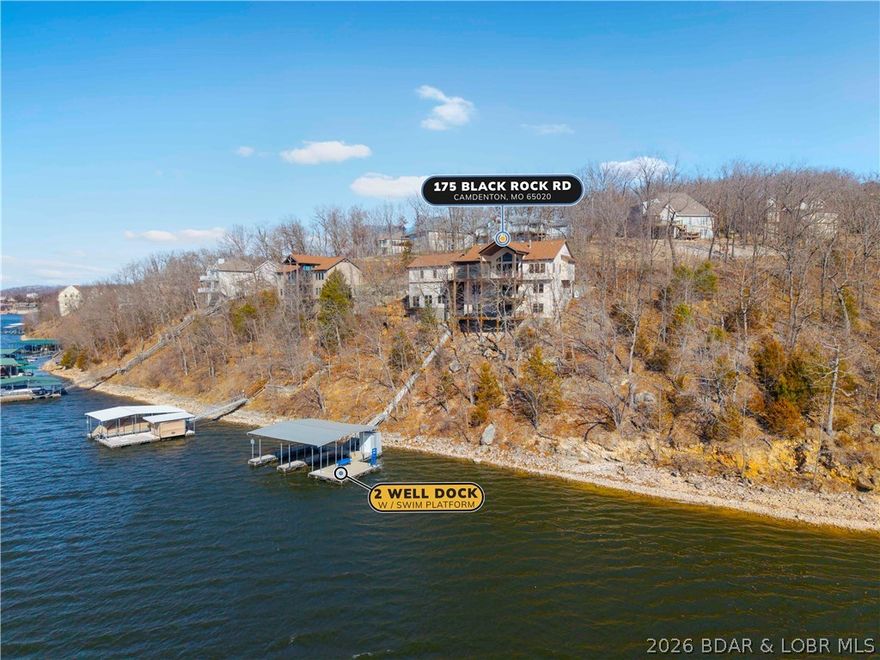 Every great lake story begins with a view and this Cross Creek estate delivers one of the most captivating settings on Linn Creek Cove. Offered by its original owner, this meticulously maintained 5-bed, 6-bath lakefront home blends timeless craftsmanship with exceptional lake living. The main level showcases soaring ceilings, rich wood accents & open, light-filled spaces designed for both everyday comfort and entertaining. The layout flows effortlessly to outdoor living, where deep, year-round water and included concrete dock create the perfect lakefront experience. The dock features two 12x30 slips, 12x22 swim platform & 4x8 storage locker, ideal for boating, swimming, and hosting lakeside gatherings.Below the three-car garage, a large unfinished area offers endless possibilities for expansion, whether a guest suite, theater room, fitness space, or game room. Located w/in the Cross Creek community, owners enjoy access to a pool & clubhouse, while the property also offers potential for short-term rental use or a 1031 exchange opportunity. Pre-listing inspected and including a one-year home warranty, this lakefront retreat delivers peace of mind along with an exceptional lifestyle.