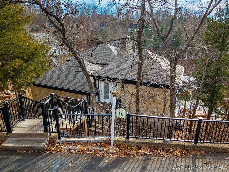 Exceptional lakefront investment opportunity in the heart of Osage Beach! Located at the 25MM within Tan-Tar-A/Margaritaville Lake Resort, this property is a proven performer for short-term rental income, or a perfect family getaway! Offering over 4,200 sq ft, this spacious home features 4 large bedrooms (three with two queen beds), 3 bathrooms, and a rarely seen open floor plan for the neighborhood. The beautifully updated kitchen and dining area flow seamlessly into a HUGE vaulted living room highlighted by a stunning floor-to-ceiling rock fireplace. The main level includes 2 bedrooms and 2 bathrooms, while the lower level offers 2 additional bedrooms, a full bath, and flexible entertaining space—ideal for large groups and rentals. Outdoor living shines with three decks, a screened porch, a permitted martini deck, and a private dock, perfect for soaking up the Lake lifestyle. Located in Tan Tar A Estates within the Margaritaville Resort complex, owners and guests enjoy amenities galore, making this a highly desirable rental destination. A rare opportunity to own a lakefront property that combines rental potential, prime location, and unforgettable Lake of the Ozarks living.