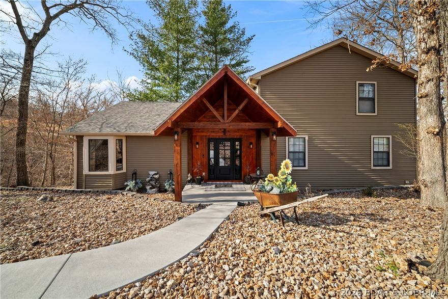 Nestled in the tranquil beauty of Linn Creek Cove, this pristine lakefront home offers a perfect balance of privacy, comfort, and space. Surrounded by mature trees and natural scenery, the setting is ideal for those who appreciate a peaceful, nature-filled lifestyle. Built in 1997, this 4,000 sq ft home features a stunning main living area with a wood-burning fireplace and an impressive wall of windows that fill the space with natural light and capture the wooded views.

The home includes 4 bedrooms and 3 full bathrooms, along with a spacious open great room designed for gathering with family and friends. The walk-out lower level adds even more living space with a large family room complete with a kitchen/bar area—perfect for entertaining. Step outside to enjoy the lakefront setting, featuring a 1-well dock tucked into the quiet cove.

The loft-style master suite provides a private retreat with its own bathroom and a generous walk-in closet. Located in the sought-after Three Rivers Subdivision, this home offers a warm, inviting atmosphere with plenty of room to host and relax.