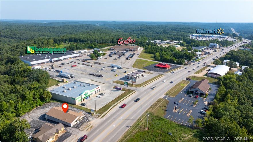 Owner Financing Available! Take advantage of 7% interest with 15% down, amortized over 20 years with a 5-year balloon. This prime commercial opportunity offers 75 feet of highway frontage with visibility to over 55,000 cars daily. The 3,200 sq ft building provides flexible space for your business needs, complemented by 16 painted parking spaces ready for customer convenience. Located in a high-traffic corridor, this property delivers maximum exposure and accessibility—perfect for retail, office, or service-based businesses looking to grow in a thriving market.