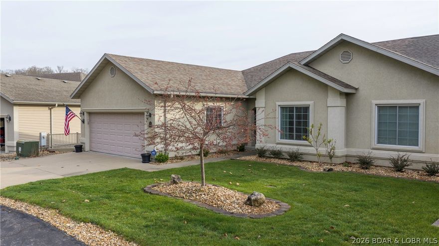 The comfort and space of a waterfront home without the price! You won't find a better value with 5 bedrooms (1 non-conforming), 3 covered decks (1 screened), 2-car garage and great cove location! This villa has been meticulously cared for with numerous upgrades  including light and bright granite and backsplash in kitchen, fresh paint and carpet upstairs, new roof, custom stone fireplace, and a unique 800 sf workshop/mancave. Located conveniently on the 3 mile mark by water and only minutes from Bagnell Dam and HWY 54 giving easy access to restaurants, retail shops and fun lake entertainment complexes. This small upscale project provides a private fun environment in a deep no wake cove--perfect for kayaking, paddleboarding or just hanging out on the small community dock --just steps from your lower deck. Living is easy at Waterfrord Landing with community pool and exterior maintenance covered by the HOA giving you more time for YOU! With 3,148 sf there is room for everyone--4 bedrooms plus bonus room, 4 full baths, 2 large living areas, 3 covered decks,  workshop, and more storage than most homes. 14x36 Slip and 2 PWC spaces just steps away. Schedule your private tour today!