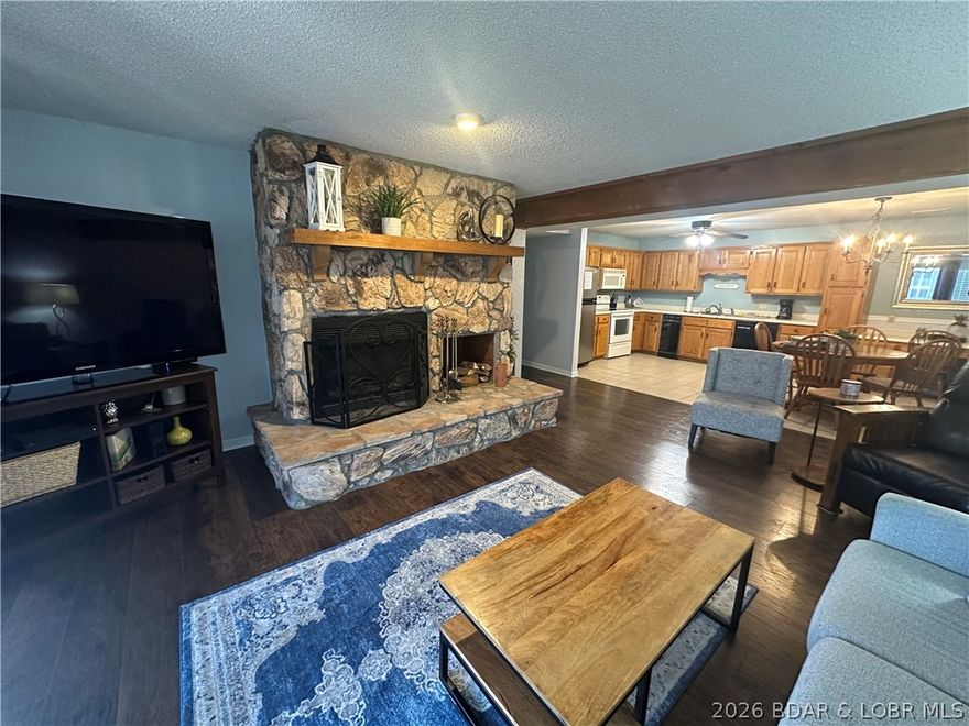 Don't miss out on this Cute Condo, Nicely Updated and in a GREAT LOCATION by Water and Land.    This Two Bedroom, Two Bath Condo is right on the Water with a great view of the Grand Glaze Channel.   Tucked in a cove with Dock protection, a nice Beach and Swimming Area.  Located in the Heart of Osage Beach within a couple miles of the New Oasis Resort and Amusement Park.    This complex is nicely maintained and has a lakeside Pool and Beach Swim Area.   A 12x32 Boat Slip comes with the Condo, and there is a 16x44 Available.   Need a Covered Slip for your Personal Watercrafts?   Not a problem, as there are additional boat slips available.    Complex allows Nightly Rentals and Also has some fulltime owners.   Fun for Everyone.