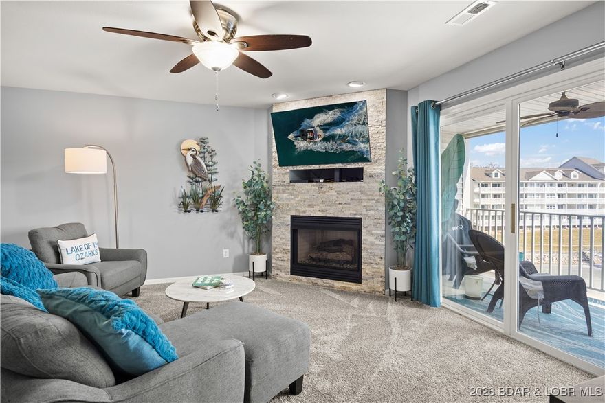 Available now at the highly sought-after Parkview Bay Condominiums, this beautiful updated 2-bed, 2-bath condo is perfectly positioned in the heart of Osage Beach on MM2 of the Grand Glaize Arm. Enjoy a premier location within the complex, offering quick access to Hwy 54, dining, shopping, entertainment, & nightlife—all while maintaining a serene lakefront setting. Facing east, the condo captures peaceful state park & lake views, excellent parking & convenient layout. This meticulously maintained unit is completely updated & move-in ready, featuring custom cabinetry, quartz countertops, LVP flooring, new carpet, a stone electric fireplace, wet bar, & open-concept floor plan with split-bedroom design. Highlights include walk-in closets, pantry, covered deck, & a primary suite w/lake view. Close proximity to the pool & the included 12x30 boat slip in Dock 5 makes lake living effortless. Nightly rentals allowed, adding investment potential. Turnkey & tastefully furnished, this condo shows beautifully. The Parkview Bay complex has undergone several updates & is well maintained. A rare opportunity for lake living, vacation use, or rental income in one of Osage Beach’s premier locations.