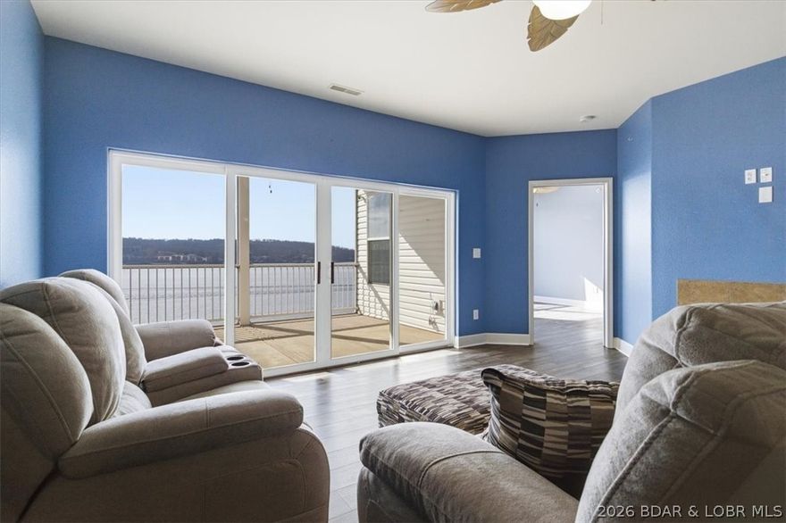 Isla Del Sol- Your Private Gated Oasis at the 3MM with unobstructed 180-degree views of the main channel giving you unforgettable sunrises and sunsets! This condo has been cherished by the same family since it was new and now it's time to pass the torch on to a new family. The resort-style island pool features zero-entry access and fun water features for the kids, surrounded by expansive sun and shade decking — all positioned to capture those panoramic main channel views. Inside, you’ll find a thoughtfully designed floor plan with quality finishes throughout. Over 1,300 Sq Ft.  The spacious primary suite and 2 Guest Bedrooms offering room for the whole family! The kitchen offers an open concept that flows seamlessly into the Living Area and the oversized sliding glass doors open to your private screened-in balcony, creating the perfect place to relax, entertain, and soak in the stunning lake views year-round. As an added bonus, this condo includes TWO(2) 12x32 boat slips, giving you immediate access to all the fun and adventure the lake has to offer. If you're looking for a no-maintenance, hassle free vacation home or investment property, this one is a must see!