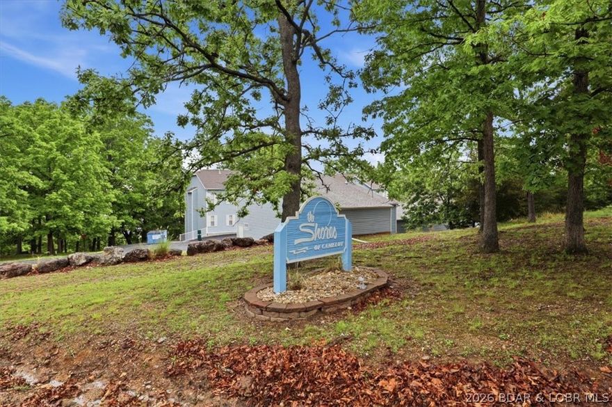 Beautifully maintained 3-bedroom, 2-bath condo located in the highly desirable Shores of Camelot Condominiums at Lake of the Ozarks! Offering lake views with lake access/easement, this spacious unit features approximately 1,500 square feet of comfortable living space, tasteful updates, and a large screened-in balcony perfect for relaxing, entertaining, and enjoying the peaceful lake scenery year-round. The condo also includes a garage, plenty of parking for family and guests, and a 10x28 boat slip—making it easy to enjoy everything lake life has to offer. Shores of Camelot offers outstanding amenities including a boat ramp, clubhouse, community pool, outdoor pool, and tennis courts. Whether you're looking for the perfect full-time home, second home, or investment opportunity, this condo is move-in ready and waiting for you to enjoy lake living at its best!