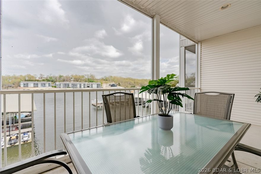 Wake up to the lake every single morning! This stunning lakefront condo at the Robins Complex puts you right in the middle of everything Lake of the Ozarks has to offer, and it shows. From the moment you walk in, you'll feel it. This place is sharp, clean, and ready to impress. Step out onto your concrete deck and soak it all in. The water is right there. And so is your very own boat slip — because life at the lake is better when you can hit the water whenever you want. Nestled in the heart of Osage Beach, you're just minutes from the best entertainment, dining, and shopping the lake has to offer. The strip, the top lakefront restaurants, the energy of it all, it's practically at your doorstep. Not to mention everything that the Robins Complex has to offer, with extremely reasonable HOA dues, and a community that welcomes you unlike any other. Whether you're dreaming of a weekend escape that feels like a vacation every time, or looking for a smart rental investment that practically sells itself to guest, this one checks every box. Strong rental appeal, a location people chase, and a unit that flat-out shows well. Opportunities like this don't sit long. Come see it for yourself.